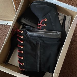 Under the knee calf high black boots.